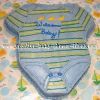 blue green and yellow onesie cake