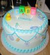 blue and white baby clothesline cake