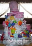 girl diaper cake with lots of baby items and a hat that says little ballerina