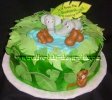 cute jungle baby shower cake with animals sitting in pond