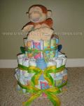 colorful giggling monkey diaper cake