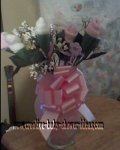 pink and white baby sock roses in vase