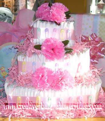 pink carnations and baby pins diaper cake