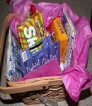 basket with tissue paper and movie night goodies