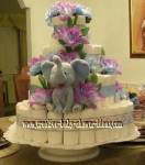 elegant blue and purple diaper cake with grey elephant and purple flowers