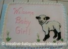 white sheet cake with baby lamb design