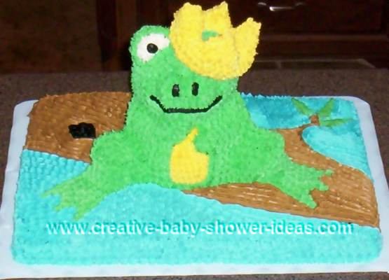 frog prince baby cake sitting on log with crown covering one eye
