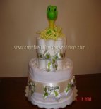 green dinosaur nappy cake