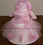 white towel cake dressed up with a pink tulle tutu skirt 