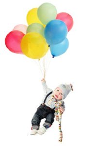 baby with scarf and hat floating holding onto colorful balloons