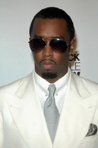 sean p diddy combs in white suit with glasses