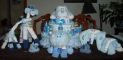 blue and white diaper cakes and animals