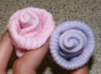 2 baby sock roses