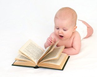 surprised baby reading book