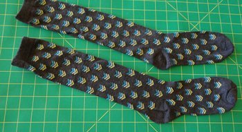 2 knee high socks laid on cutting board