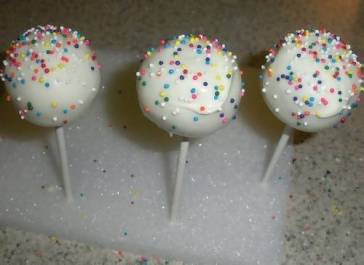 cake lollipop sprinkled with colored sprinkles 