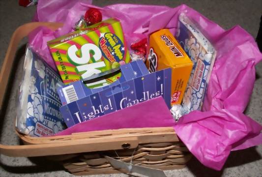 movie basket filled with gifts for a baby shower hostess