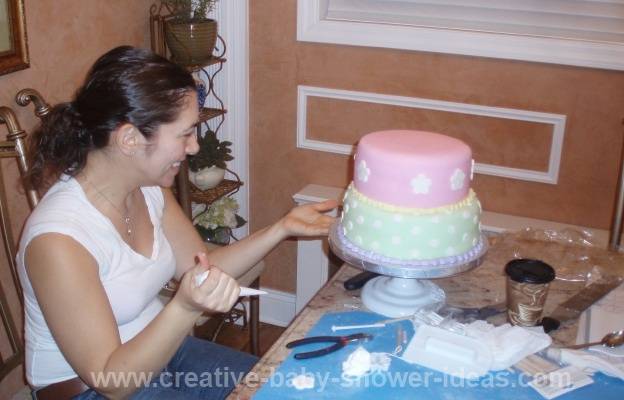 cake decorator making noahs ark baby shower cake