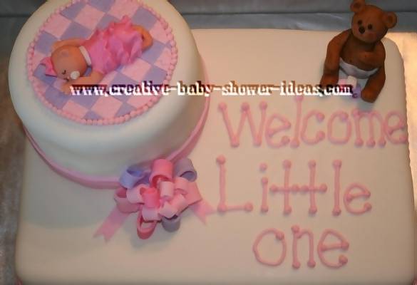 pink purple and white baby shower cake