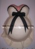 white and black pregnant belly shower cake
