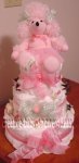pink girl diaper cake with pink poodle on top wearing a tutu