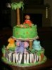 jungle baby shower cake with monkeys, hippos, lion and an elephant
