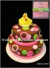brown pink and green polka dot cake with baby chicks to match invitations