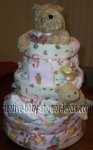 pink and white winnie the pooh diaper cake