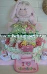 pink bunny in a floral dress diaper cake