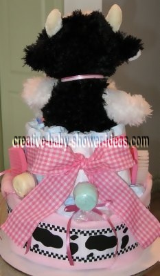 back of cow diaper cake with cute spotted ribbon