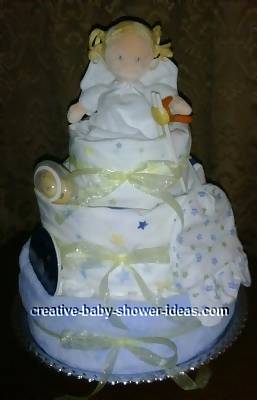 3 tier angel diaper cake wrapped in blue and white blankets