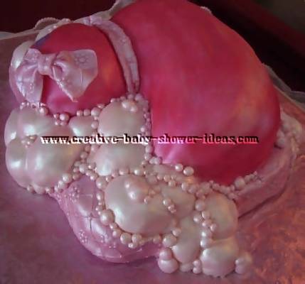 back of pink duck cake showing bubbles and pink pillow
