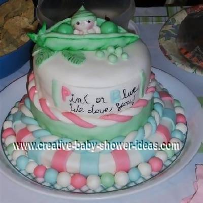 pink blue and green pea in a pod baby cake that says pink or blue we love you!