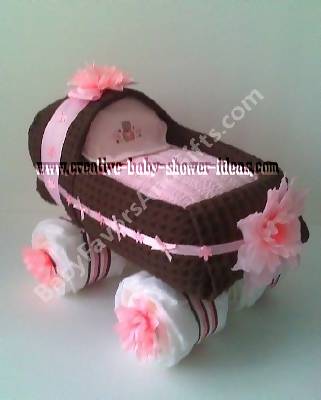 brown and pink baby buggy diaper cake