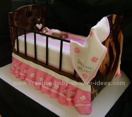 pink and white baby crib cake