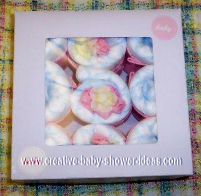 9 mini baby diaper cupcakes in a a gift box