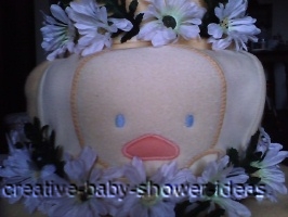 closeup of front of diaper cake with duck baby bib