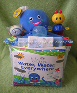 front of octopus diaper baby cake with baby einstein book