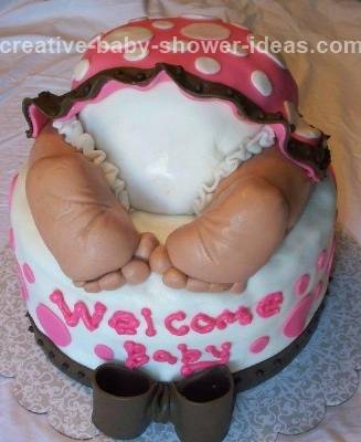 white baby cake with pink polka dots and baby bum and feet with white bloomers showing under polka dot dress