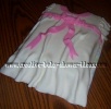 white baby shower dress cake with pink bow