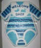 long sleeved blue striped onesie cake with a bib