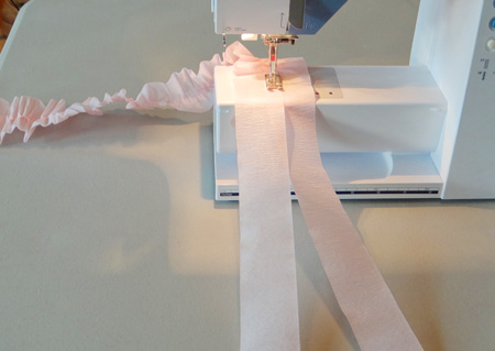 crepe paper going through sewing machine to create ruffles