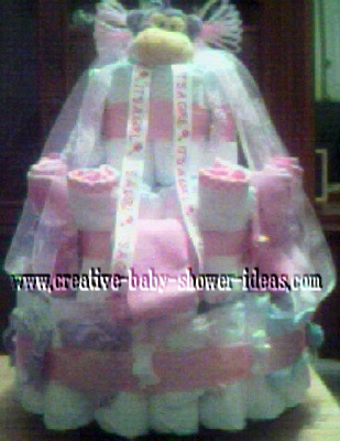 pink and white monkey diaper cake