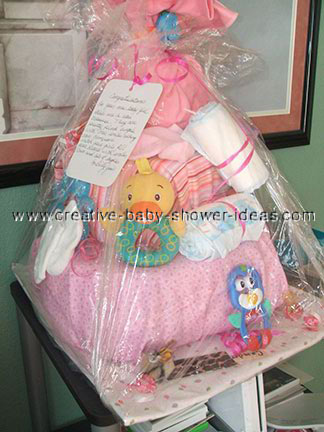 pink blanket with duck rattle diaper cake
