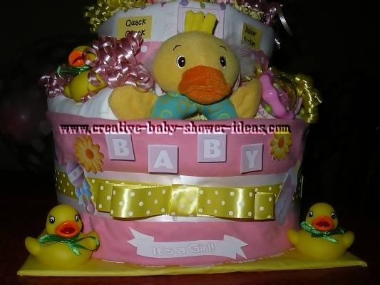 closeup of bottom layers of duck diaper cake with baby letters