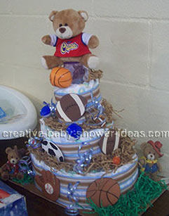 side of sports bear diaper cake with football basketball baseball and soccer ball