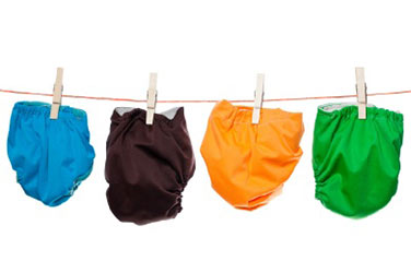 colored diapers hanging on a clothesline