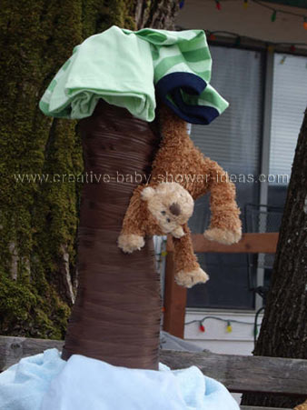 closeup of diaper cake showing monkey hanging from tree