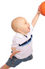 baby in air with a basketball dunking a hoop