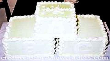 cream and white blocks baby shower cake